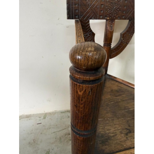 138 - A carved Swedish tripod monks chair