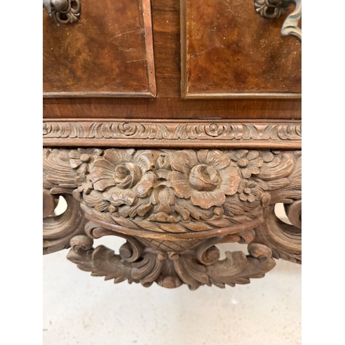 148 - A Queen Anne style cocktail cabinet on cabriole legs H185cm W104cm D52cm