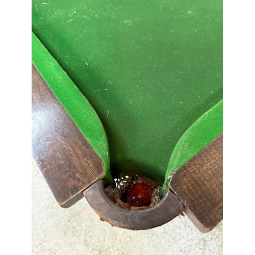 153 - A mahogany dining table on baluster legs with removable top revealing a green base snooker table H79... 