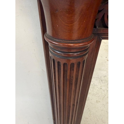 162 - A mahogany overmantel mirror with carved top and fluted columns to sides 122cm x 95cm