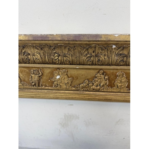 169 - A Regency style giltwood mirror frame with a Neoclassical frieze to the top and flanked by Empire st... 