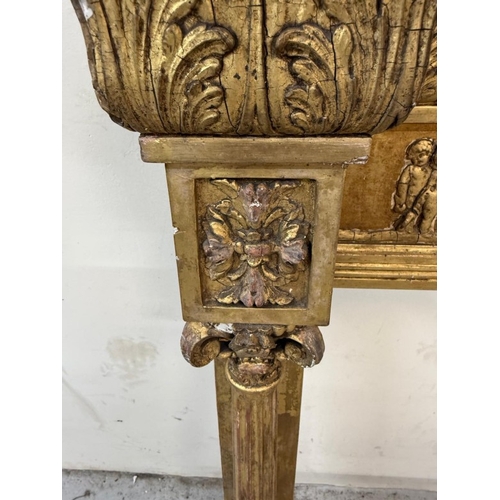 169 - A Regency style giltwood mirror frame with a Neoclassical frieze to the top and flanked by Empire st... 