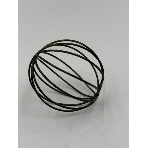 170 - An extremely rare Victorian or Edwardian cat toy, the near-spherical metal wire cage containing a sm... 