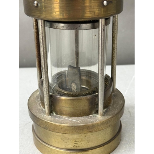 178 - Two brass and copper miners' lamps, Ashington Colliery and E Thomas and William Ltd
