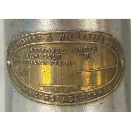 178 - Two brass and copper miners' lamps, Ashington Colliery and E Thomas and William Ltd