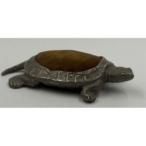 66 - A Chinese pewter tortoise pin cushion