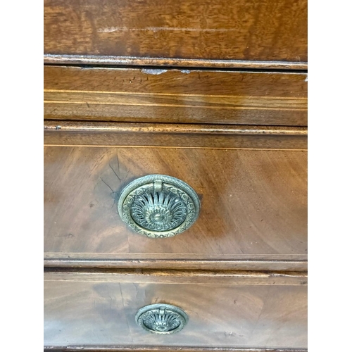 83 - A mahogany four-drawer chest of drawers with brass hoop handles H108cm W104cm D52cm