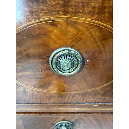 83 - A mahogany four-drawer chest of drawers with brass hoop handles H108cm W104cm D52cm