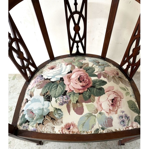 88 - A mahogany tub chair with a floral upholstered seat with tapered legs H75cm W53cm D46cm