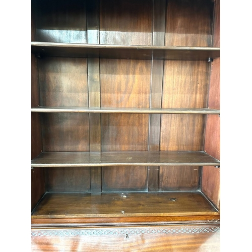 93 - A glazed mahogany bureau bookcase above a sloped writing desk with graduated drawers H206cm W90cm D4... 