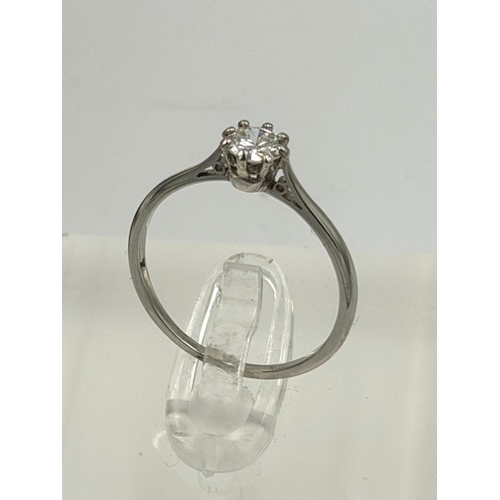 571 - A platinum diamond ring approximate weight 2.1g and size N by Biggs of Maidenhead.