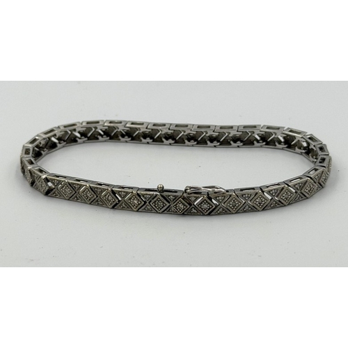 581 - A 9ct white gold pave diamond style bracelet, approximate weight 14.1g