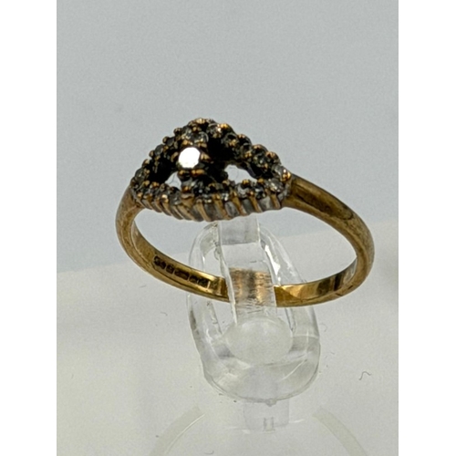 586 - A 9ct gold diamond ring with an approximate weight of 2.1g and size N