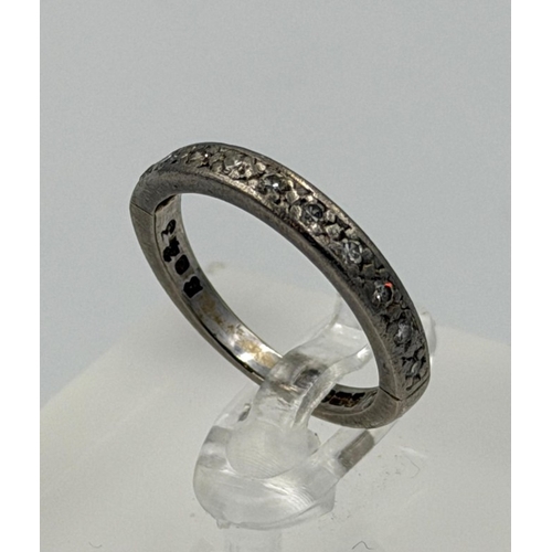 587 - An 18ct white gold half eternity ring with an approximate size of L and weight 3.6g
