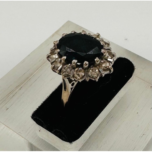 594 - An 18ct gold set sapphire and diamond cluster ring, approximate weight 5.8g and size L