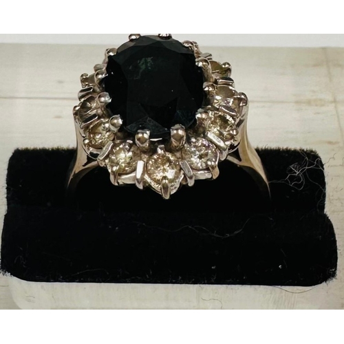 594 - An 18ct gold set sapphire and diamond cluster ring, approximate weight 5.8g and size L