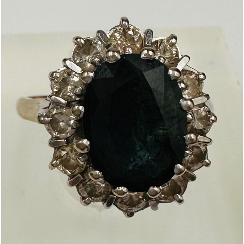 594 - An 18ct gold set sapphire and diamond cluster ring, approximate weight 5.8g and size L