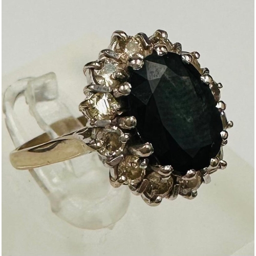 594 - An 18ct gold set sapphire and diamond cluster ring, approximate weight 5.8g and size L