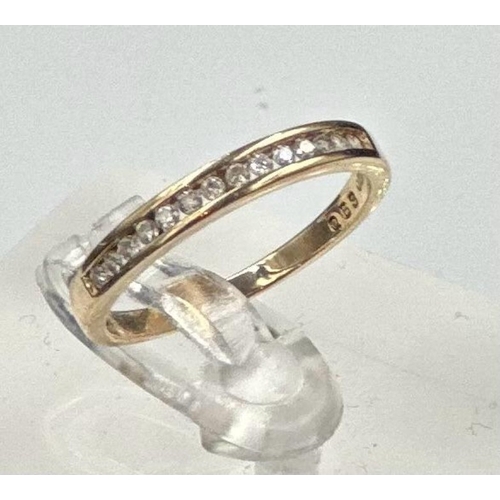 596 - A 9ct gold partial eternity diamond ring with an approximate weight of 1.6g