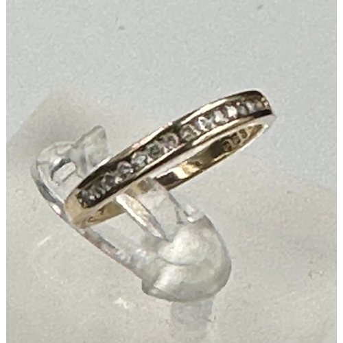 596 - A 9ct gold partial eternity diamond ring with an approximate weight of 1.6g