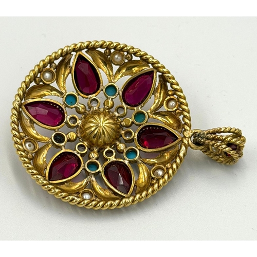 597 - A fabulous multi gem stone circular pendant with an approximate weight of 24g, 45mm diameter, set wi... 