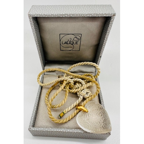 603 - A Lalique heart on a fabric rope style necklace