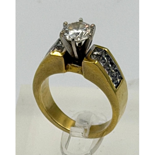 604 - A single 1.25ct round brilliant diamond 18ct ring with channel set shoulders, two rows of ten prince... 