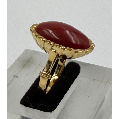 609 - An 18ct coral gold ring, approximate weight 8.9g and size L.