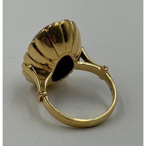 609 - An 18ct coral gold ring, approximate weight 8.9g and size L.