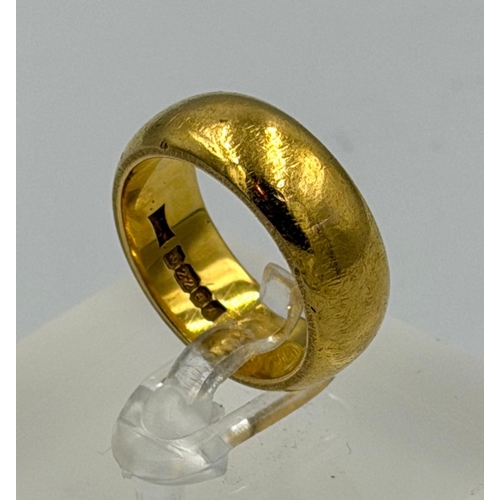 613 - A 22ct yellow gold wedding band, approximate size M and weight 13.6g