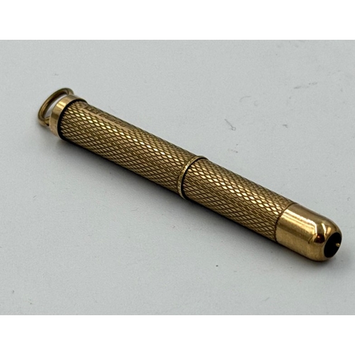617 - A 9ct gold extendable toothpick, approximate weight 6.6g