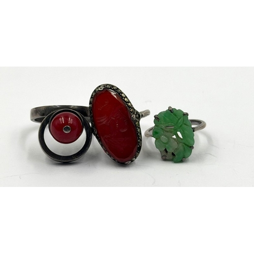 618 - Three vintage silver rings in varying styles and finishes including one jade. Along with a silver Ch... 