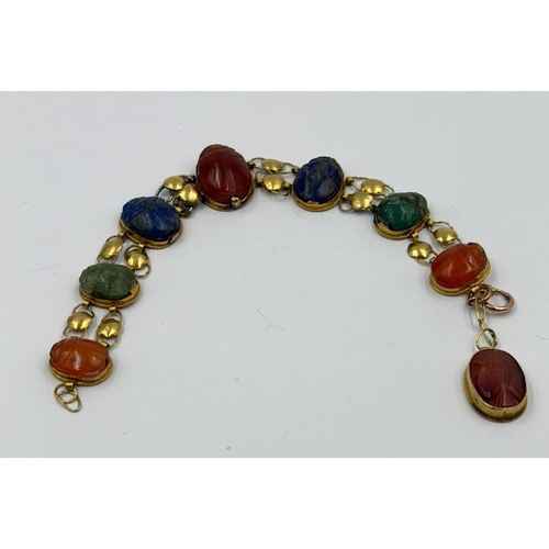 622 - Vintage Egyptian Revival bracelet featuring carved stones set in gold