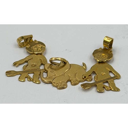 623 - A selection of three 9ct gold pendants, an elephant and two devils, approximate weight 5.2g