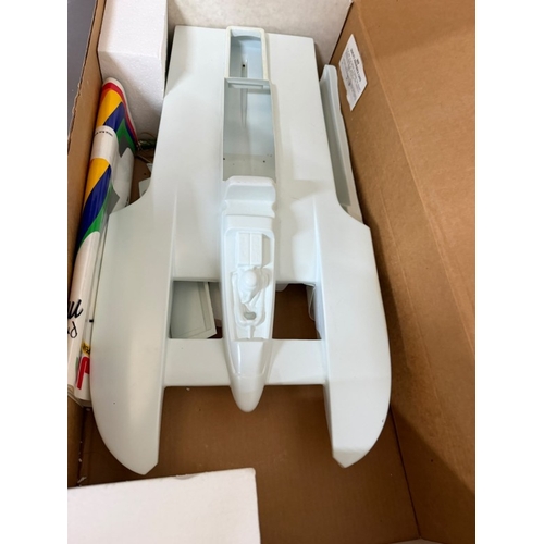 A boxed model kit of speed boat.