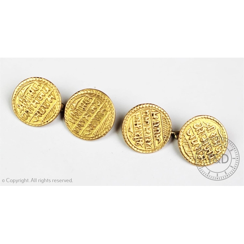 106 - A pair of cuff links, each designed as two Indian coins joined by a bar link, gross weight 12.9gms (... 