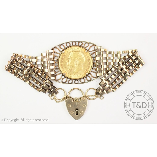 113 - A George V gold sovereign dated 1912, set within a 9ct gold gate link bracelet, with 9ct gold padloc... 