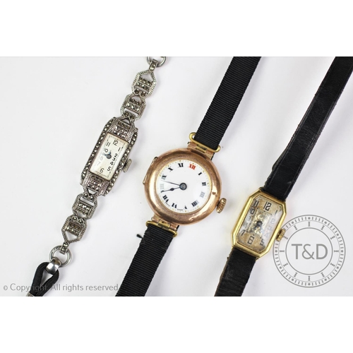 145 - A 9ct gold cased ladies wristwatch with white enamel dial and black roman numerals, along with a fur... 