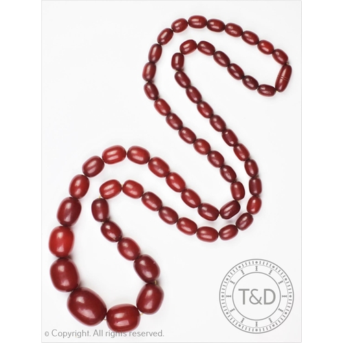 188 - A cherry amber bead necklace, the single strand graduated bead necklace weight 92.5gms