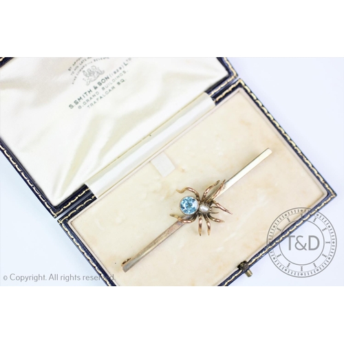 193 - A Victorian spider brooch ‘CE*FS’, the gold bar set with a central spider with blue zircon abdomen a... 