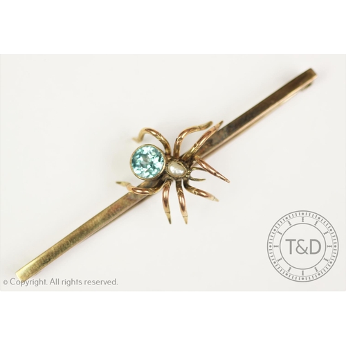 193 - A Victorian spider brooch ‘CE*FS’, the gold bar set with a central spider with blue zircon abdomen a... 