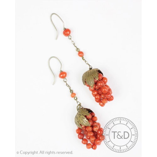 195 - A pair of coral coloured bead set grape and vine leaf drop earrings, each with hoop fitting and susp... 