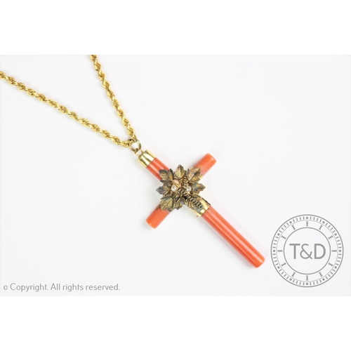 196 - A Victorian coral set cross pendant and chain, the coral set cross centred by a foliate spray with s... 