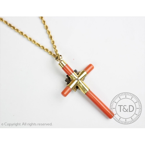 196 - A Victorian coral set cross pendant and chain, the coral set cross centred by a foliate spray with s... 