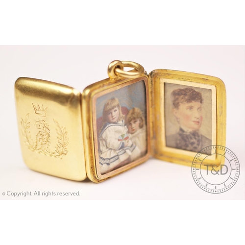 252 - A Victorian crested locket, designed as a rectangular bi-fold pendant enclosing four apertures conta... 