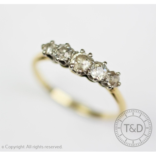 268 - A five stone diamond ring, the five graduated old cut diamonds, all claw set in white metal, to the ... 