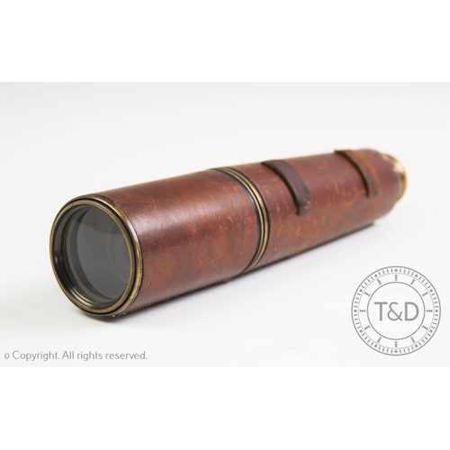 333 - A 19th century three drawer lacquered brass and leather bound maritime telescope, extending to 82cm ... 