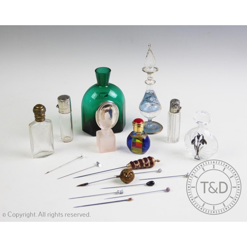 71 - A collection of scent bottles, to include; a Victorian silver topped scent bottle, London 1891, with... 