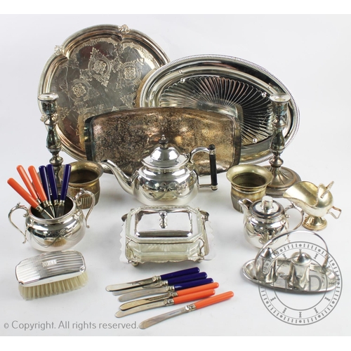 92 - A selection of silver plate, to include; an early 20th century three piece tea service, a pair of ca... 