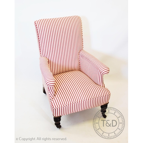 938 - A Victorian upholstered walnut armchair, with red and white striped upholstery and on ring turned wa... 